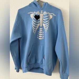 Blue Hoodie with Silver Ribcage Graphic and Black Heart